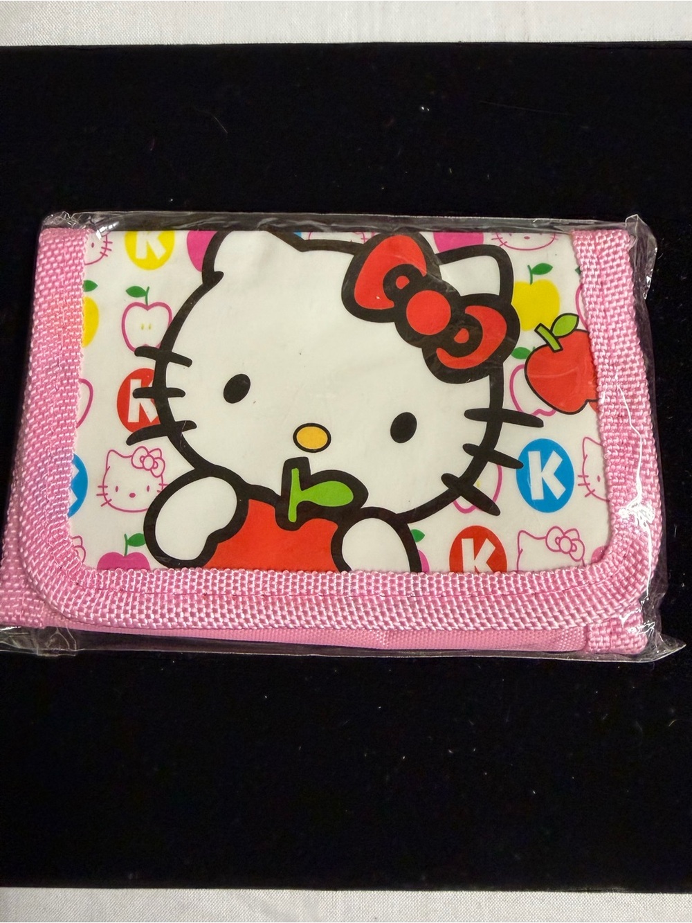 Hello Kitty Pink Wallet with Red Apple Graphic